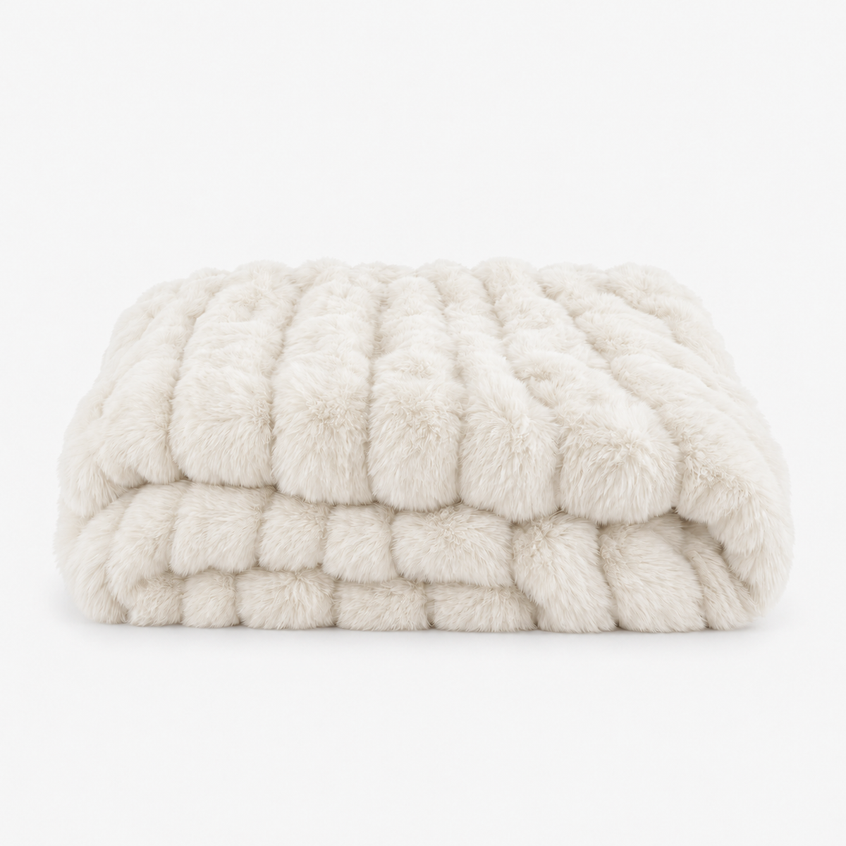 Molvari white faux fur throw blanket in a loose fold photographed on a plain studio backdrop #color_white