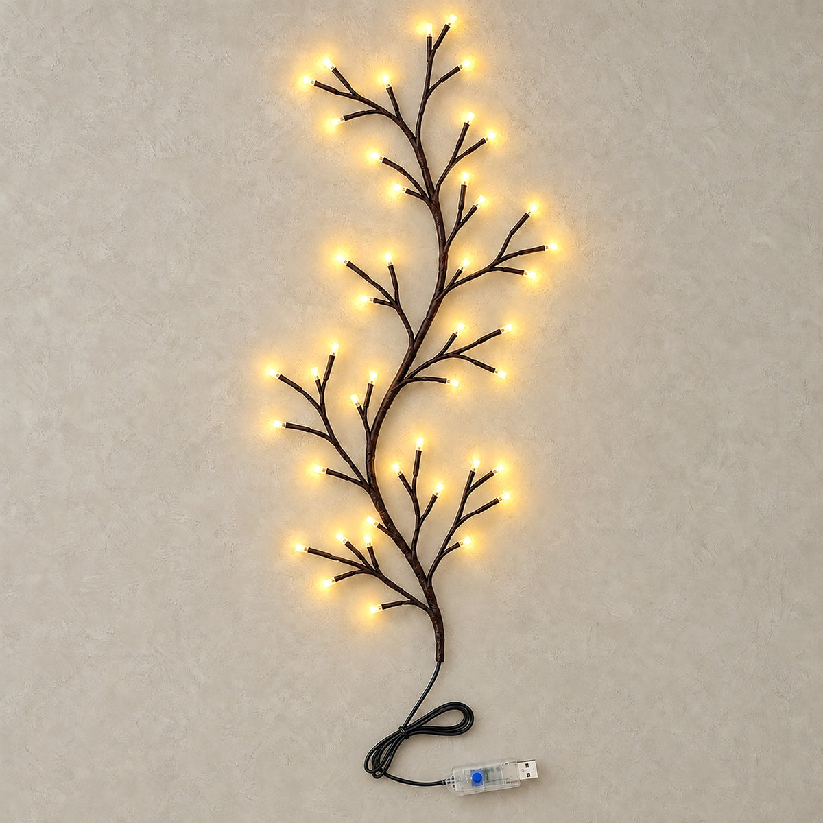 Morlica dark brown USB vine string light lit up, with a warm white glow at every bare LED tip