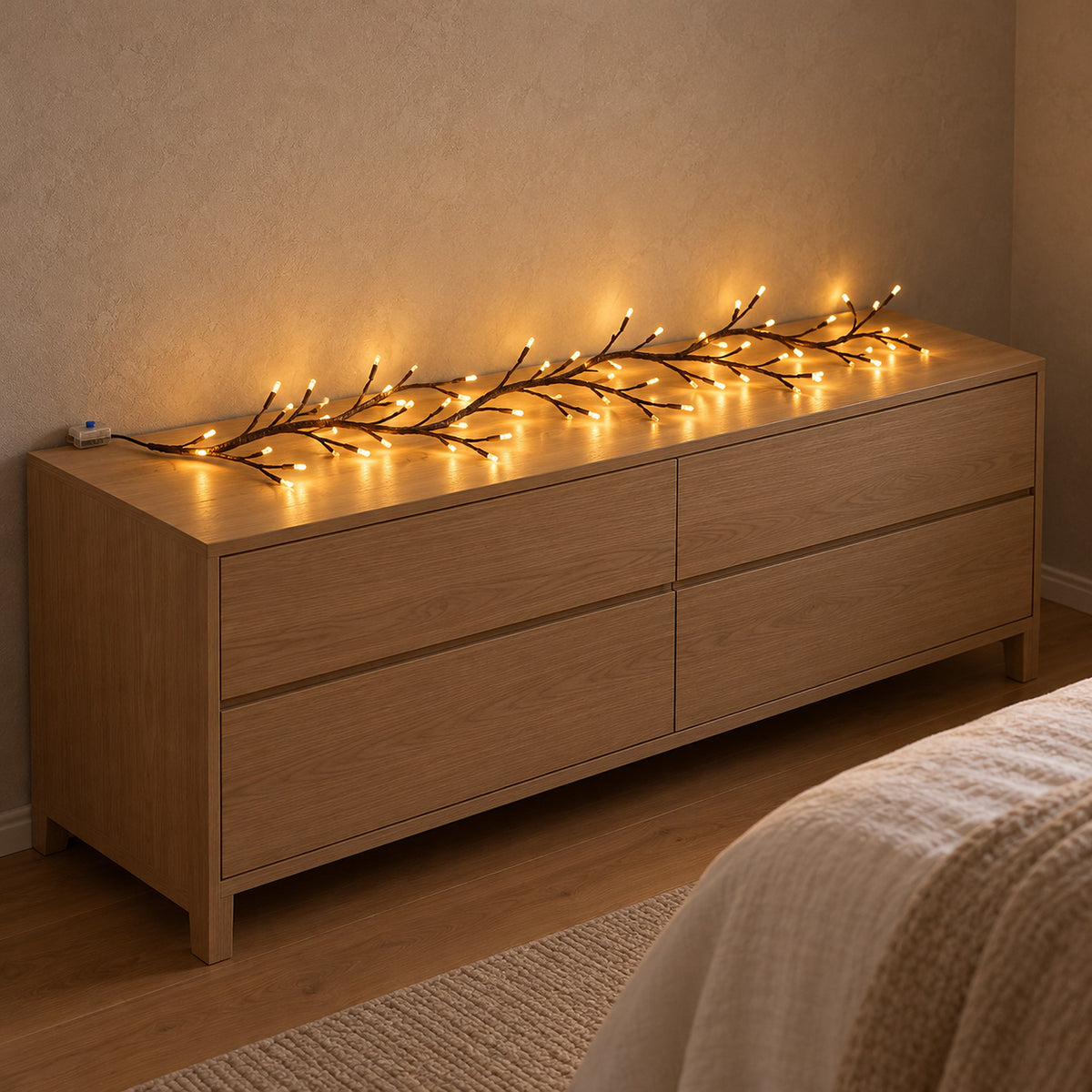 Morlica dark brown USB vine string light glowing across a bedroom dresser beside its USB controller