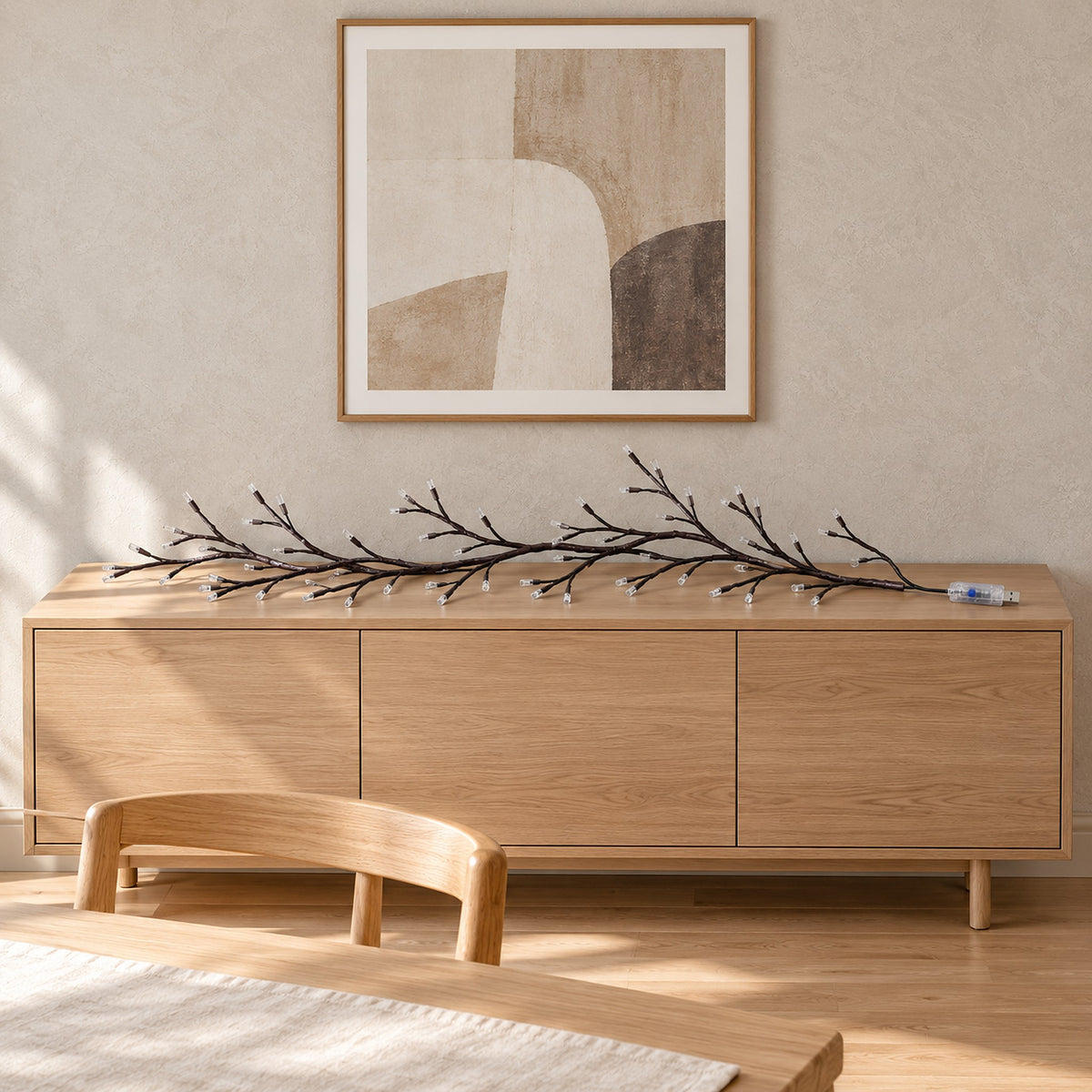 Morlica dark brown USB vine string light lying unlit on a wooden sideboard with USB connector and controller