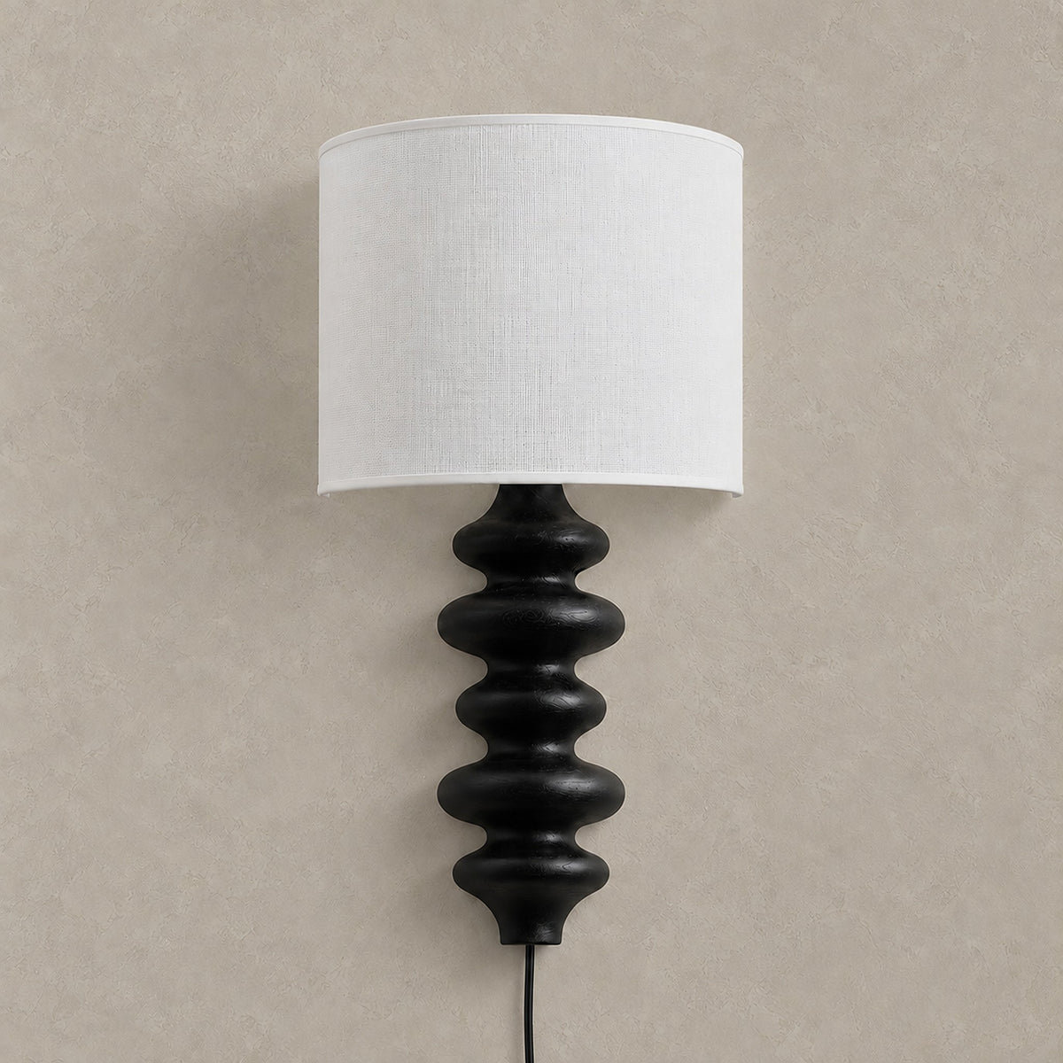 Nalimor black plug in wall sconce with linen shade and solid wood body, shown unlit