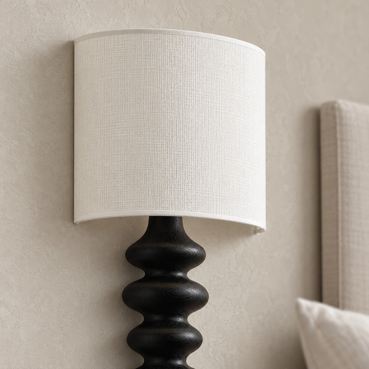 Nalimor black wall sconce close up of the linen shade and solid wood body