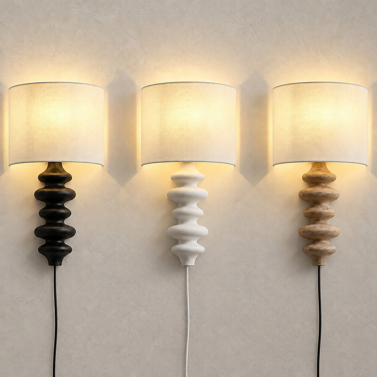 Nalimor wall sconces in black, white and wood color, all three lit together
