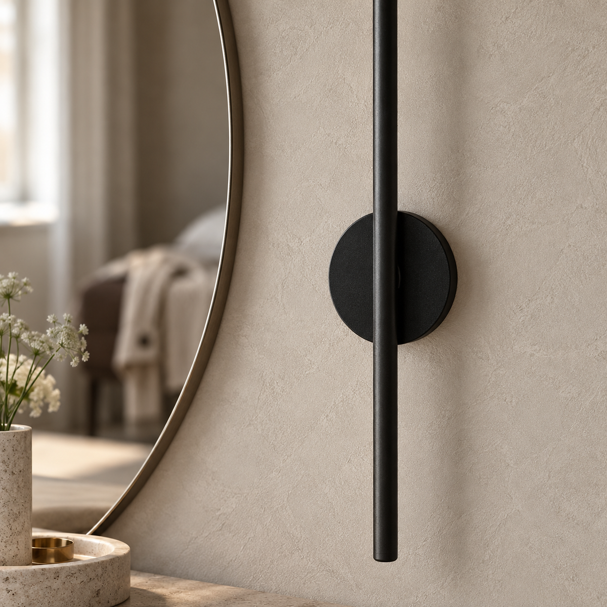Nedrila black battery operated wall sconce close up on the aluminum finish and circular base