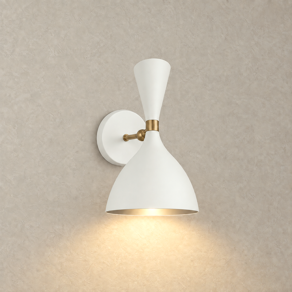 Nematore white wall lamp lit on a plain plate with a warm downward wash of light