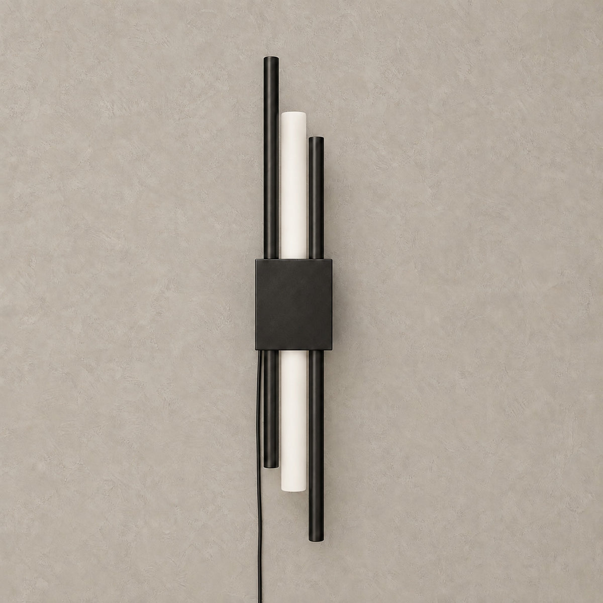 Nemirsa black plug in wall sconce, unlit, with slim staggered rods on a plain backdrop