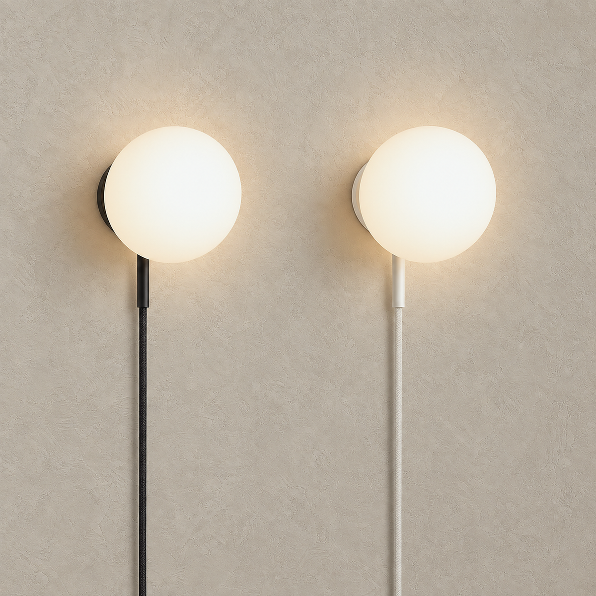 Neravolo wall sconces in black and white glowing side by side with frosted glass globes