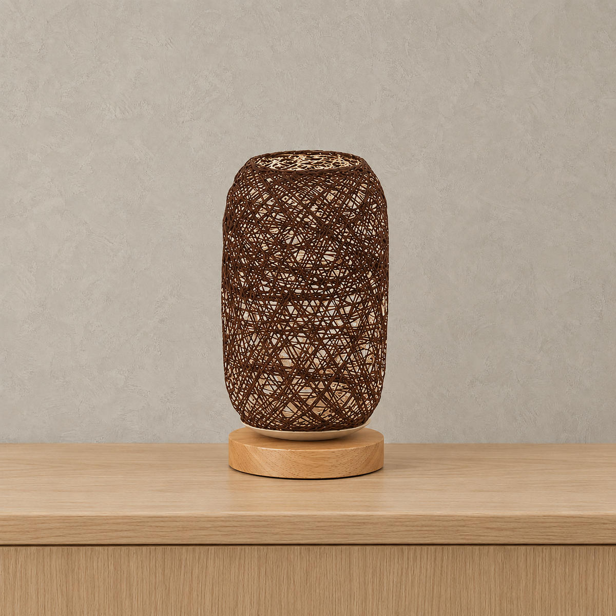 Nerilva brown rechargeable table lamp with handwoven shade, unlit on a pale surface