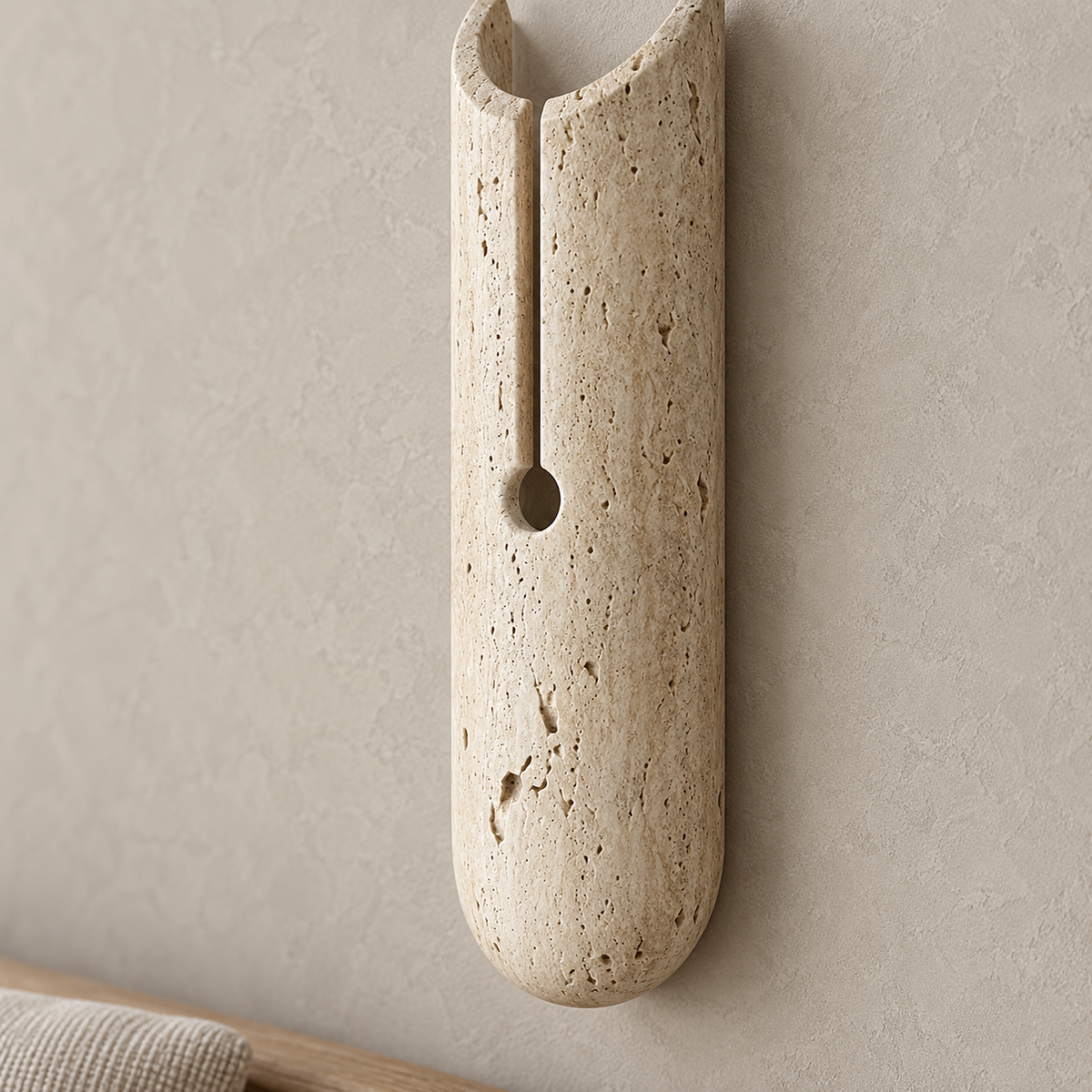 Nerisalo beige plug in wall lamp in close detail showing the texture of its stone body