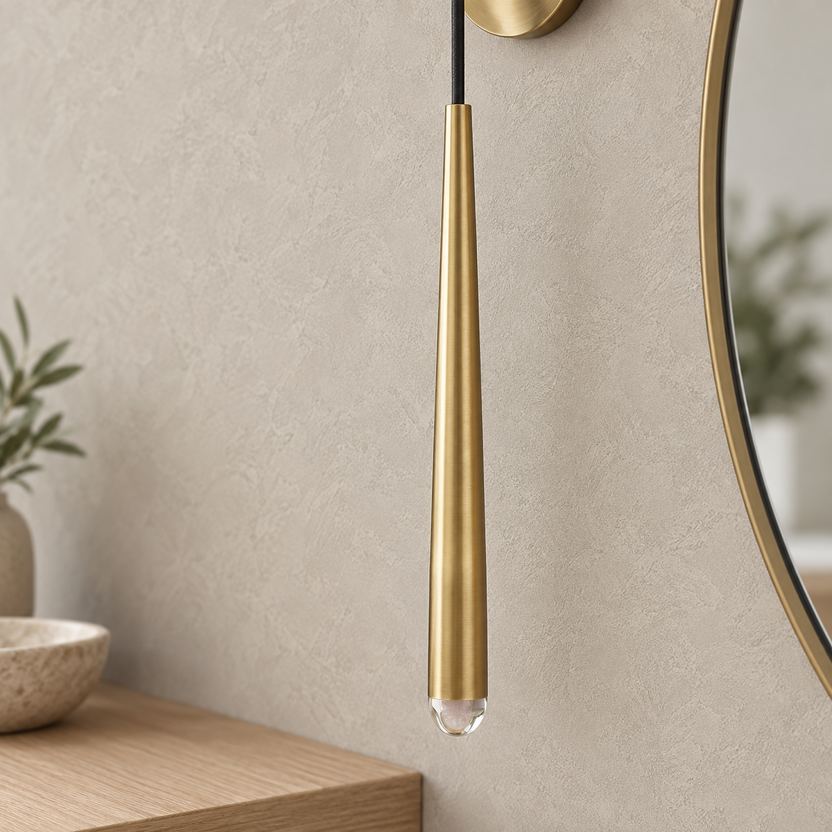 Nerisavo polished brass hanging wall sconce unlit, close up on the brass body and crystal tip