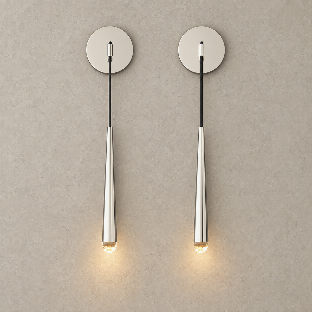 Nerisavo silver wall sconce set of 2 lit as a pair on a plain studio backdrop #color_silver