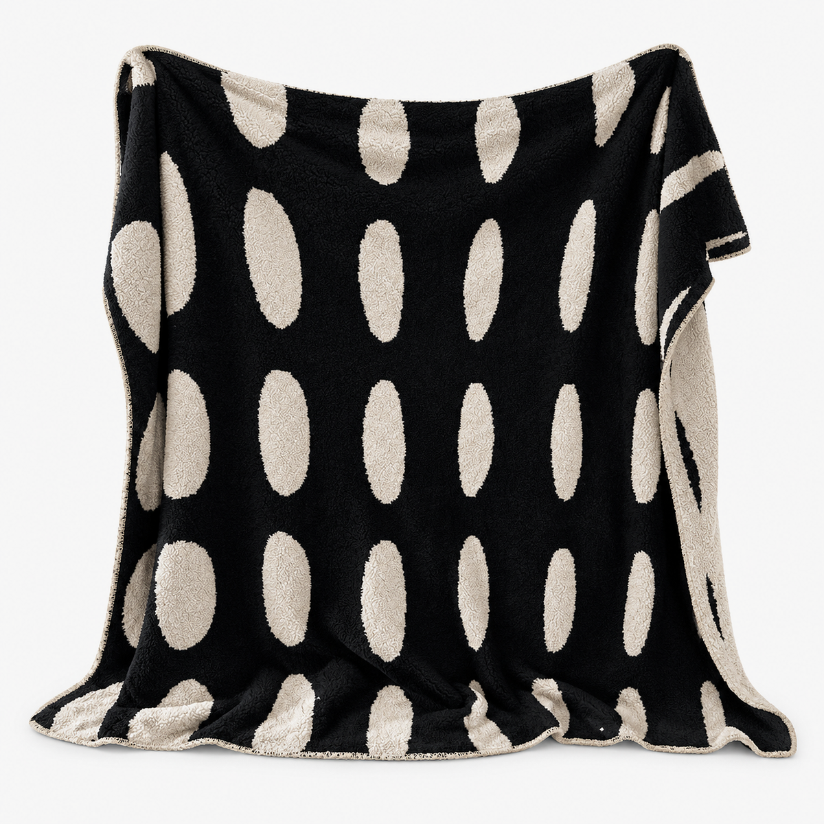 Nesavori black and white reversible fleece throw blanket shown fully open on a plain background