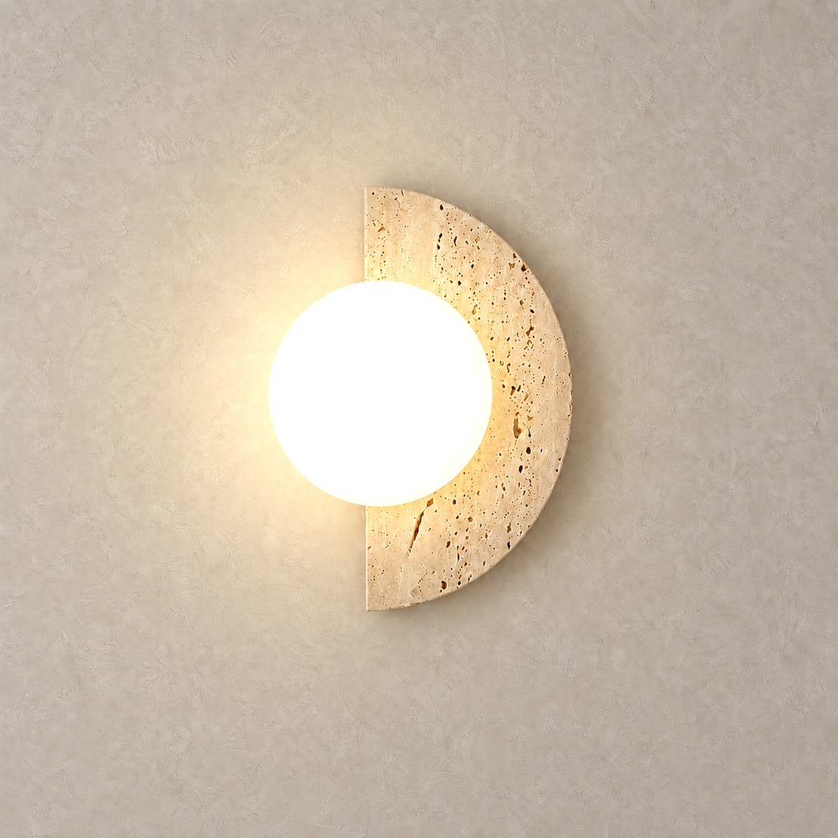 Nevaline beige and white bedside wall light glowing softly against pale plaster