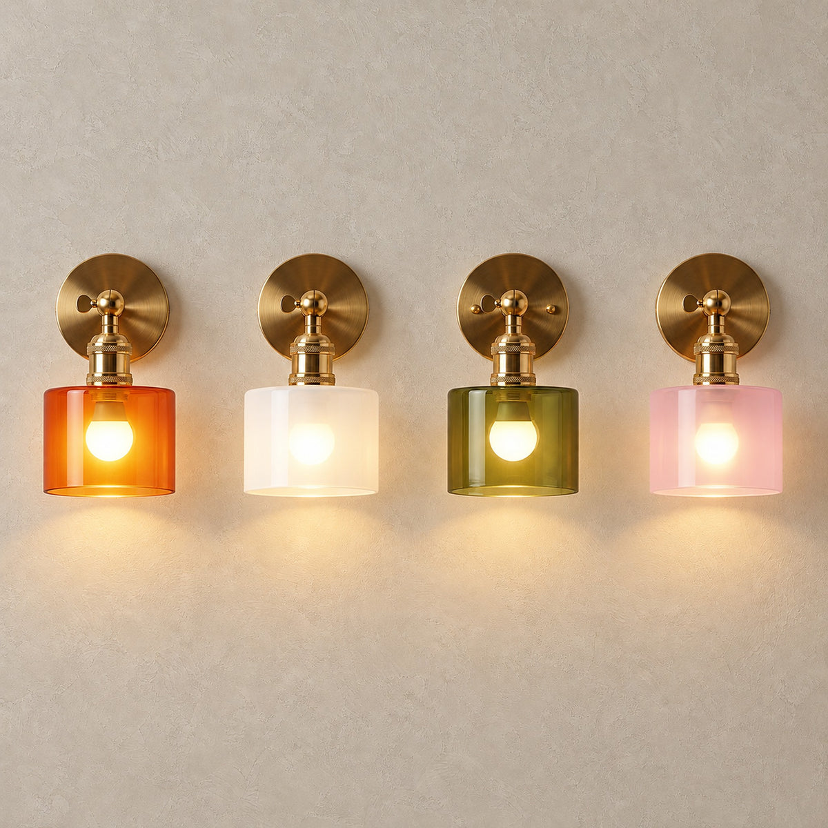 Nevalto orange, white, olive and pink wall lamps side by side, each glowing with warm light