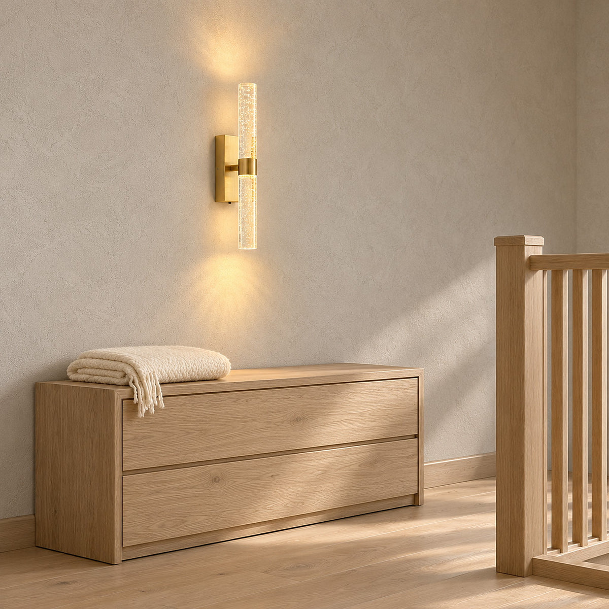 Nimarlo gold LED wall sconce lighting a stair landing with a glow above and below