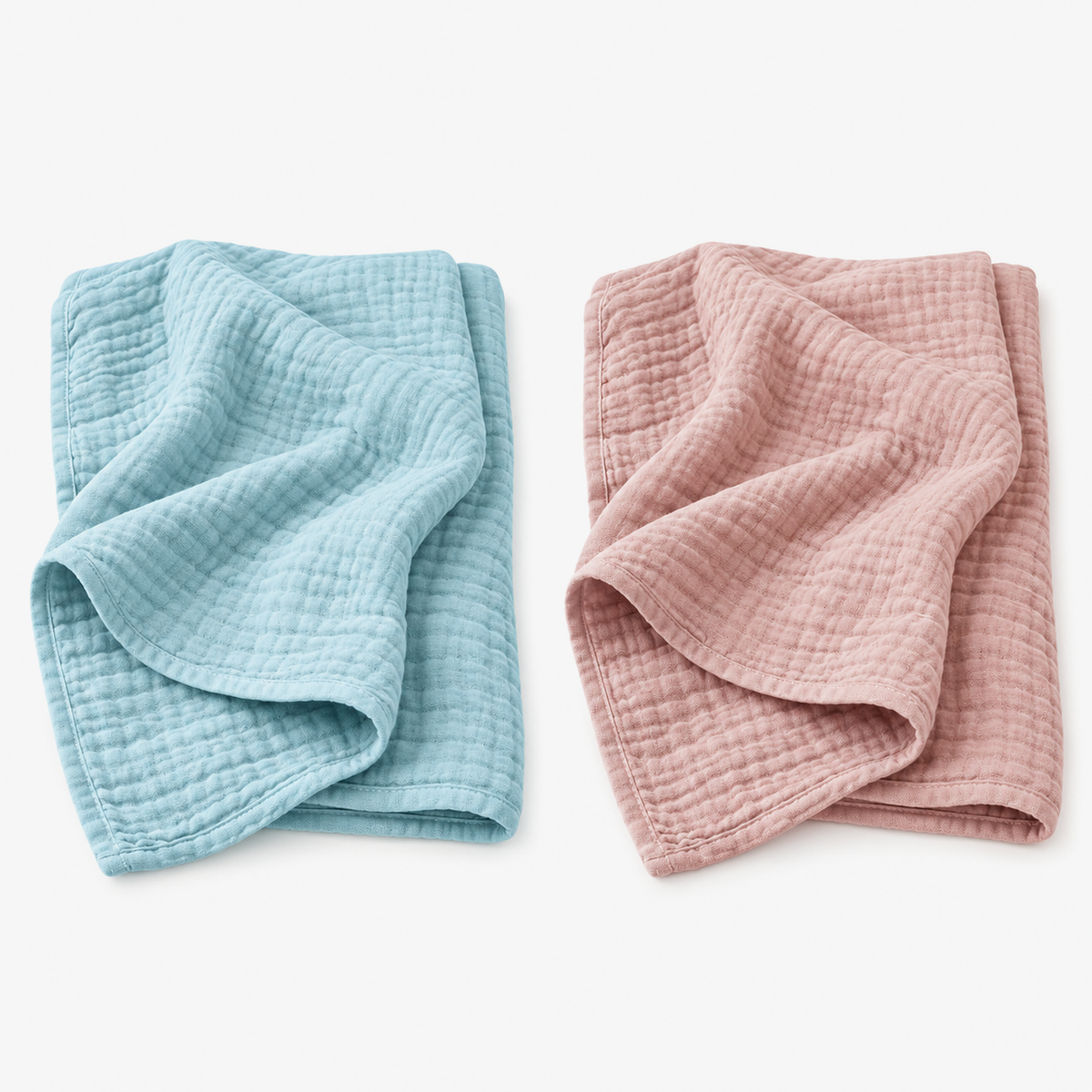 Nolavira blue and pink cotton throw blankets folded side by side on a white background