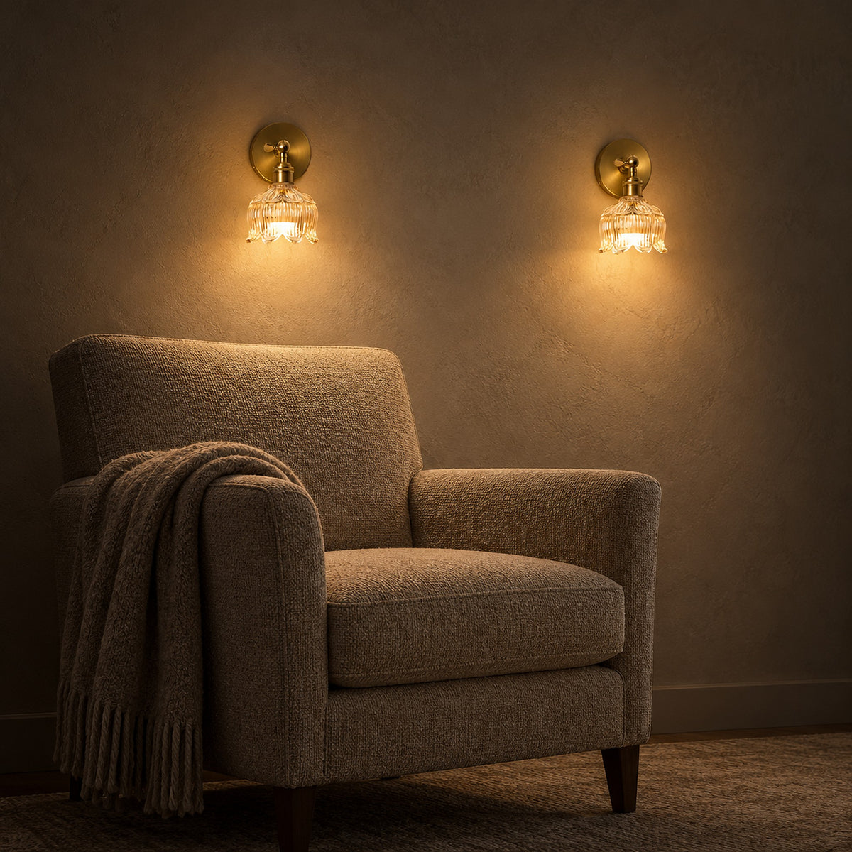 Nolavire gold wall light pair with clear ribbed shades glowing warmly above an armchair with a draped throw