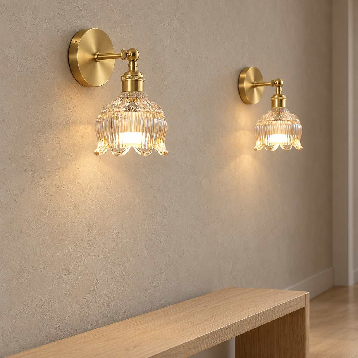 Pair of Nolavire golden cordless wall lights glowing through a clear glass shade on a hallway wall