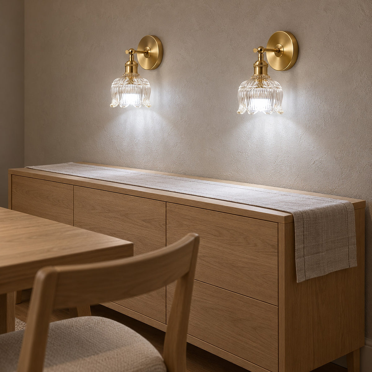 Pair of Nolavire golden led wall sconces set to cool white light on a dining room wall