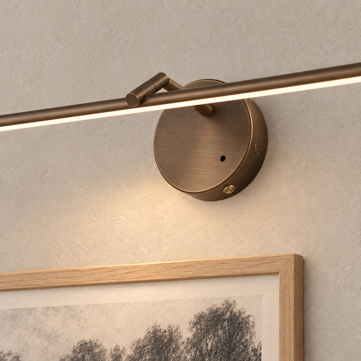 Nolesira bronze LED wall sconce close up on the round mounting base and slim edge #color_bronze