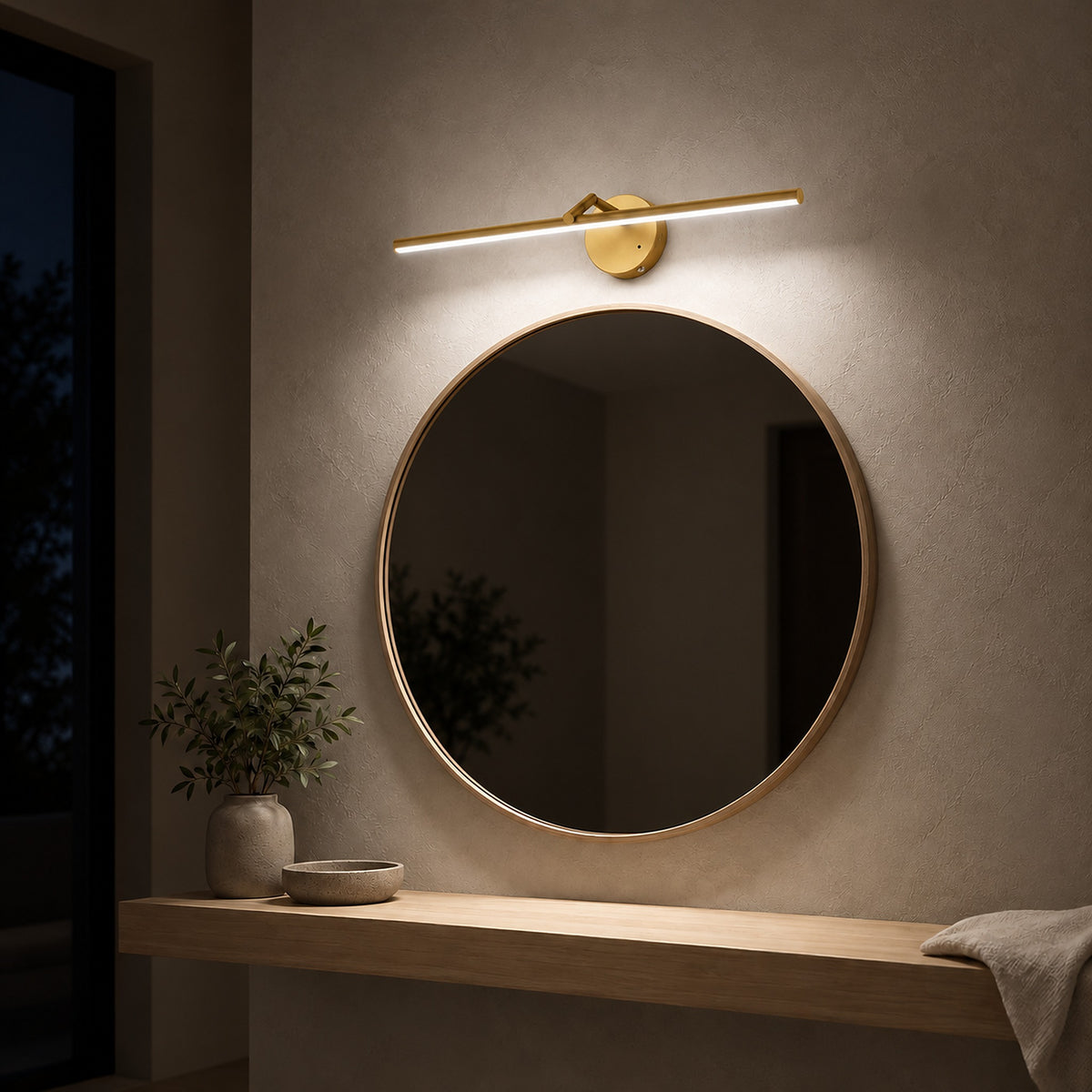 Nolesira gold cordless wall lamp lighting a dressing mirror softly after dark #color_gold