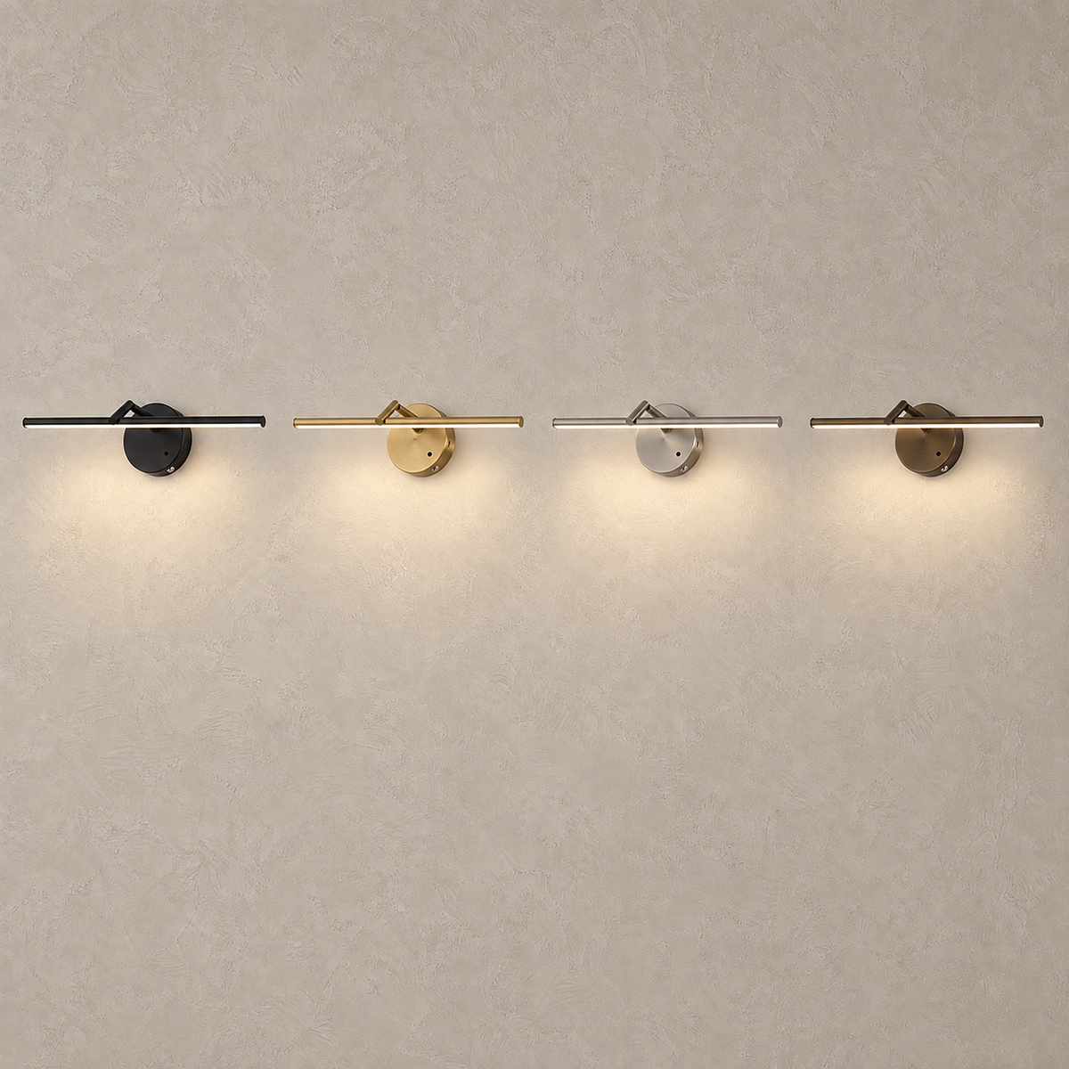 Nolesira LED wall sconce in matte black, brushed gold, brushed nickel and aged bronze lit side by side