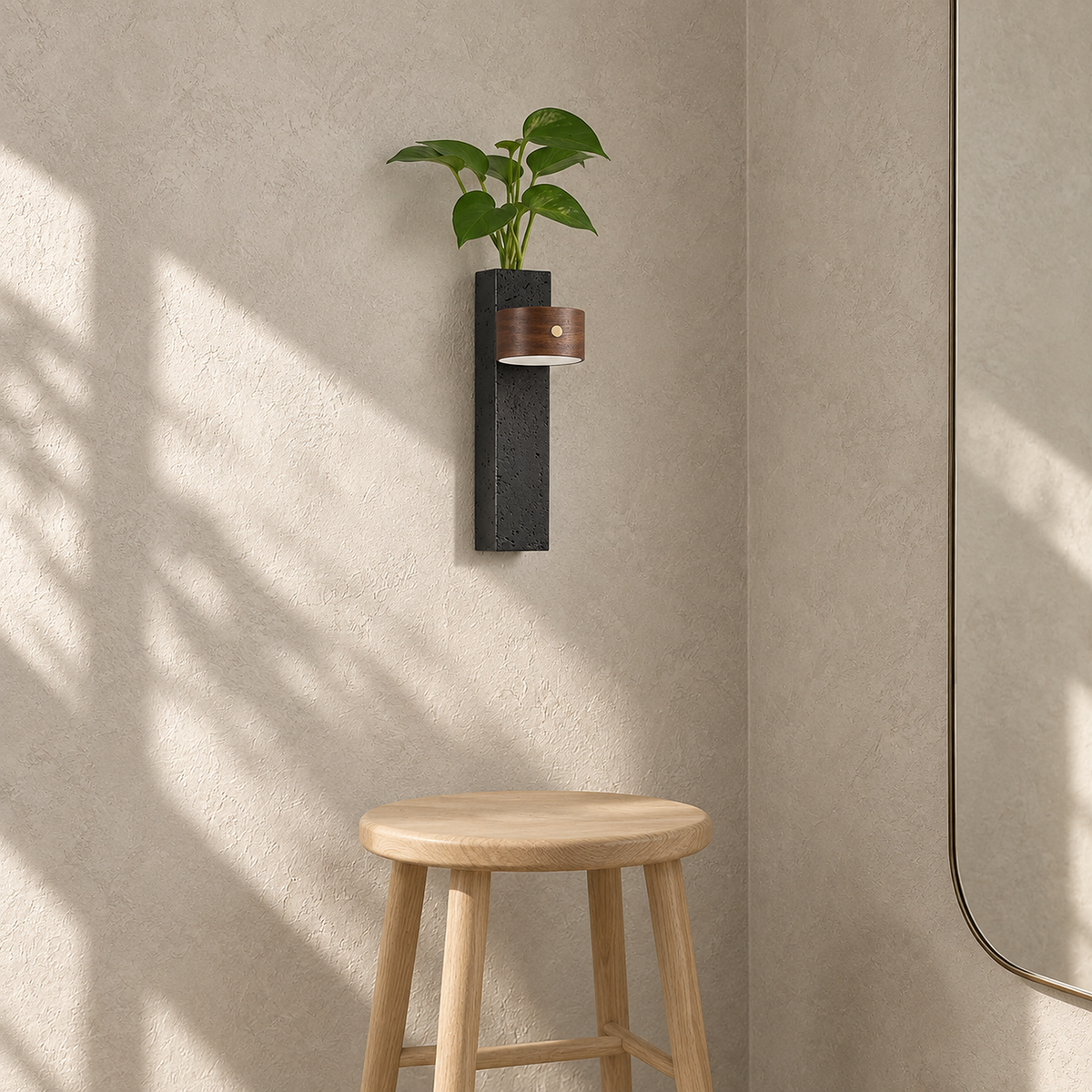 Nuvelira LED wall sconce in dark walnut & black travertine unlit and planted in a sunlit dressing room