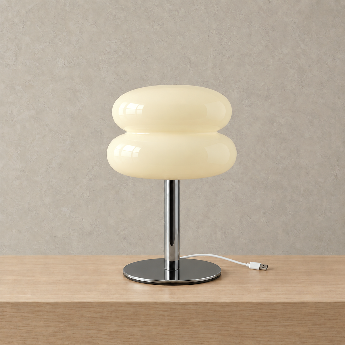 Olimena table lamp in buttercream, unlit with a silver colored stem and round iron base #color_buttercream