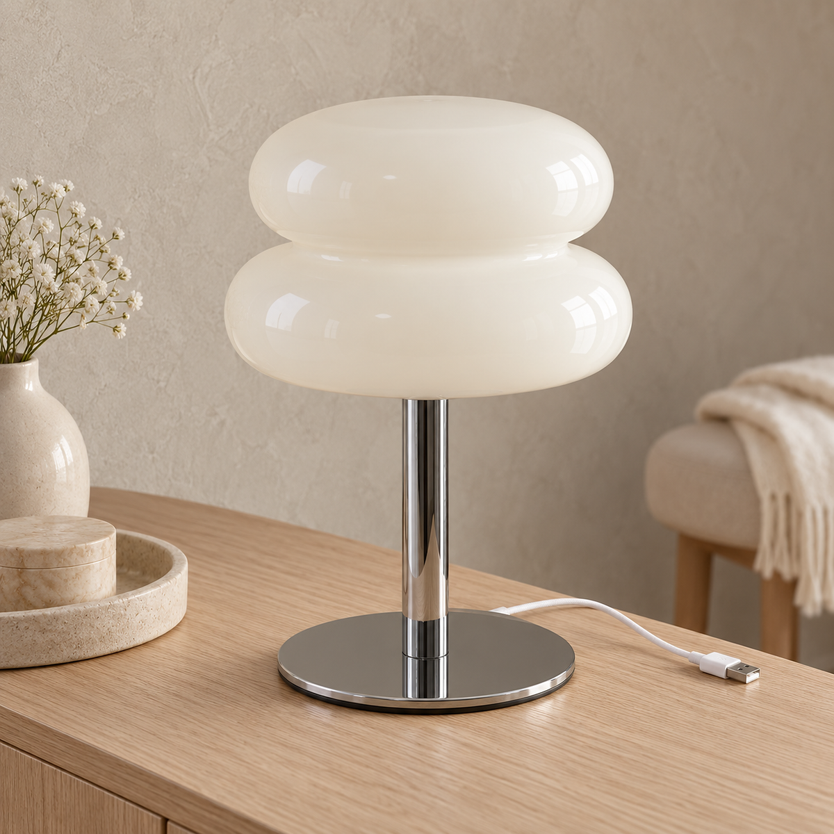 Olimena table lamp in pearl, a close look at the glossy glass shade and silver colored body