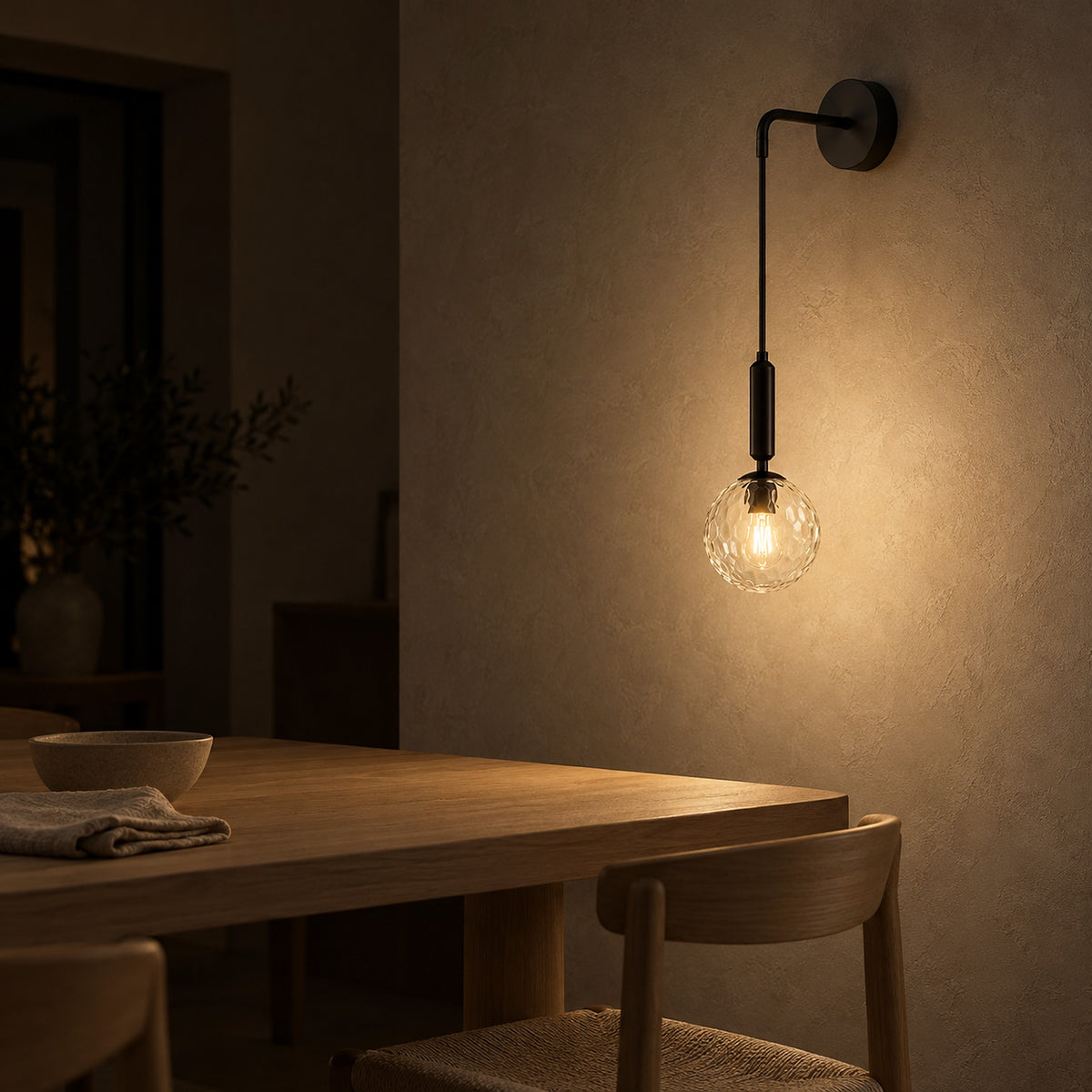 Orlamen black hardwired wall sconce with glass globe lighting dining room plaster at night