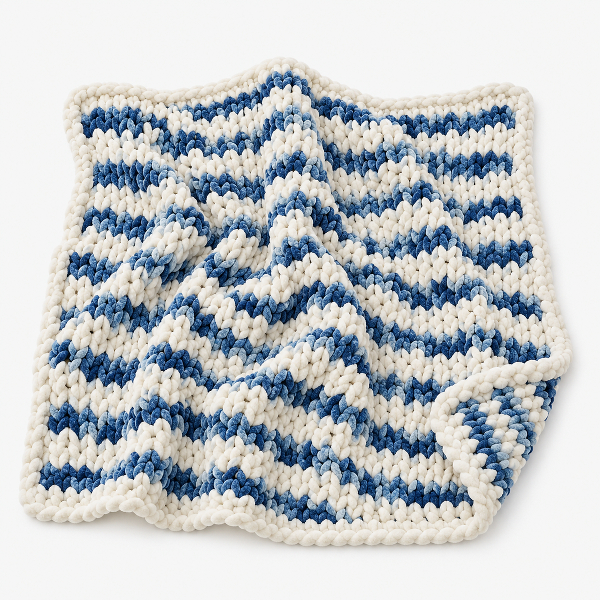 Orvelsa blue and white stripe chunky knit throw blanket laid fully open, showing its big rounded loops