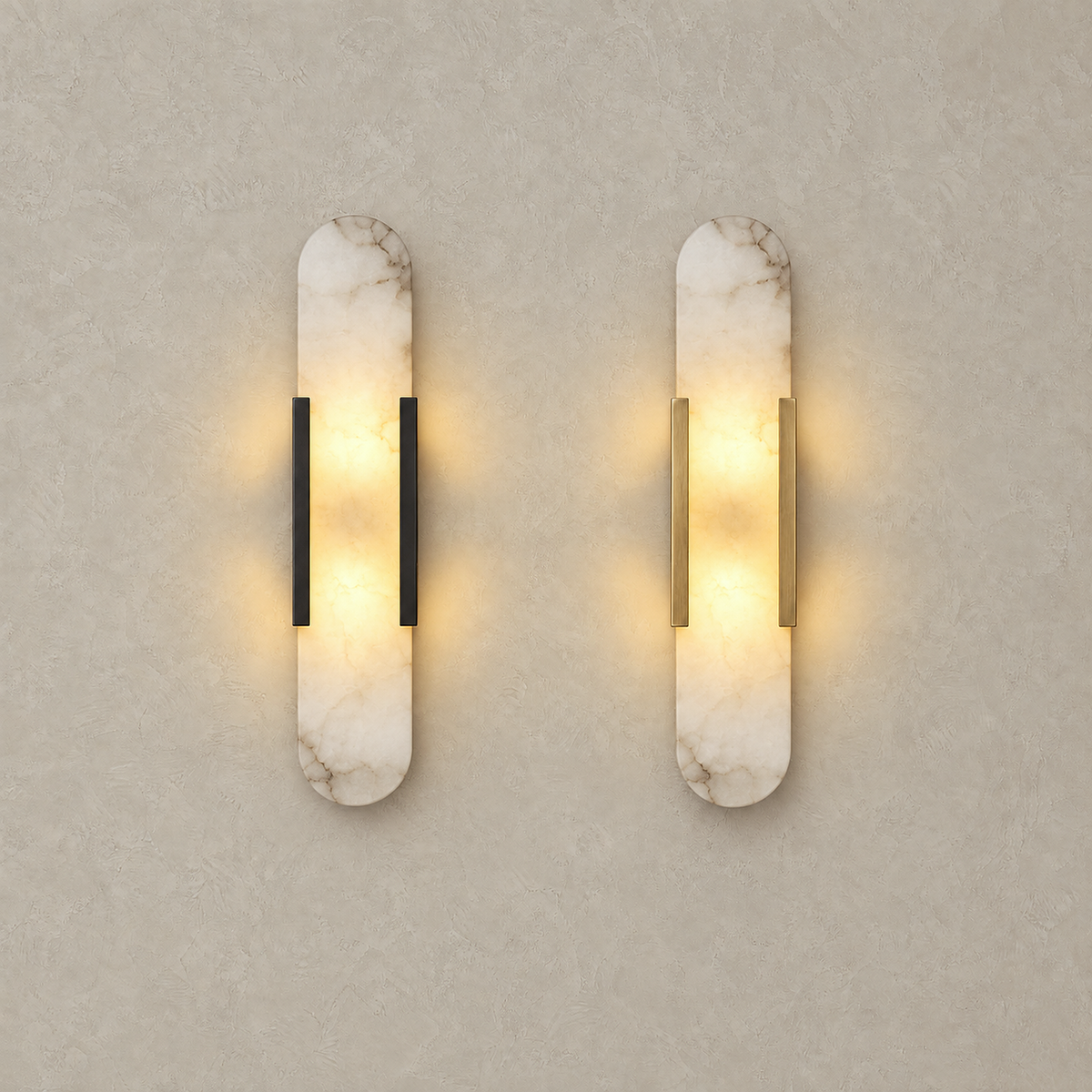 Oselira black and gold wall sconce shown side by side, both lit with a soft glow through the marble