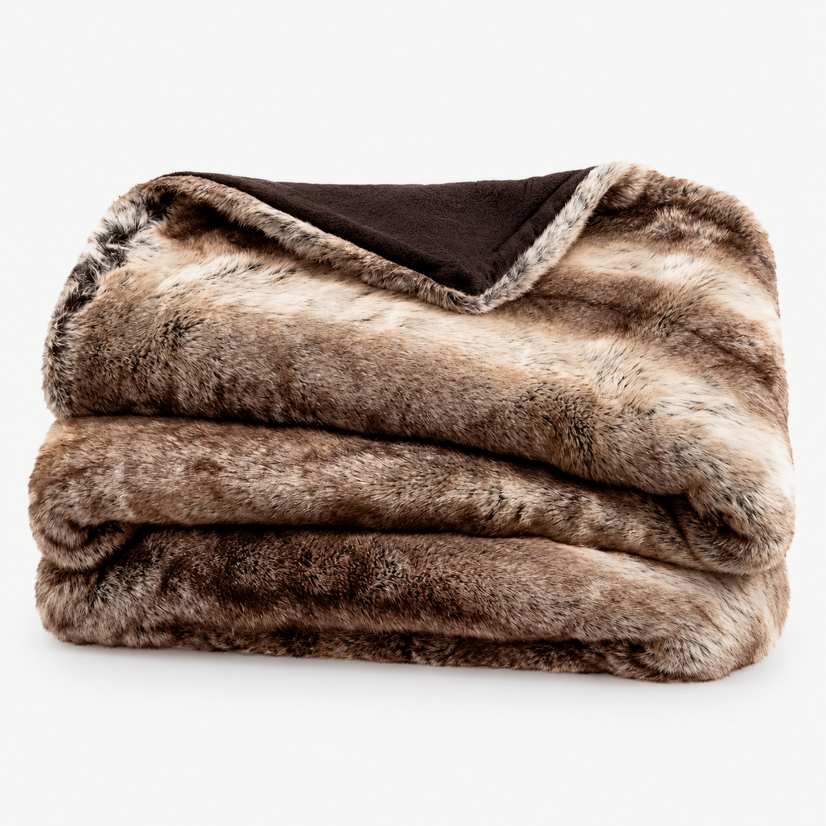 Pelarno brown faux fur throw blanket loosely folded on a plain white background