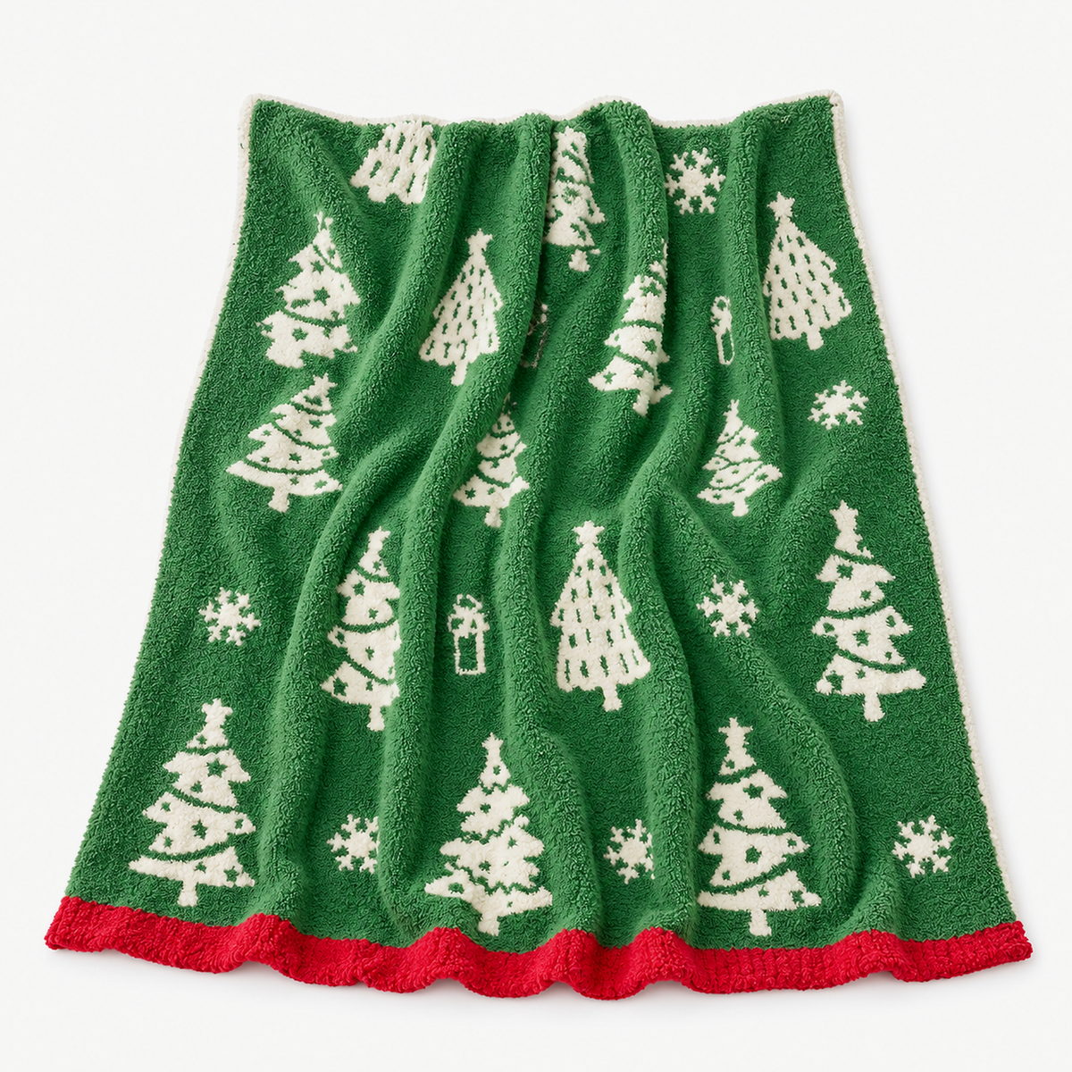 Ravolen green and white christmas throw blanket laid fully open to show its tree and snowflake design