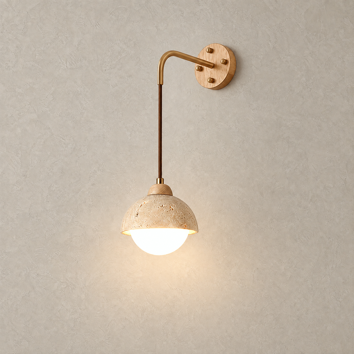 Relmino model B wood wall sconce glowing on a plain plate with its suspended dome shade