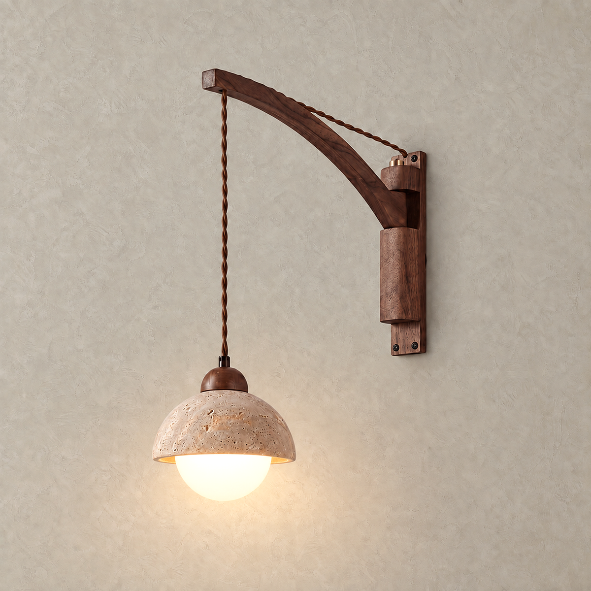 Relmino yellow travertine LED wall sconce lit against a greige plaster wall