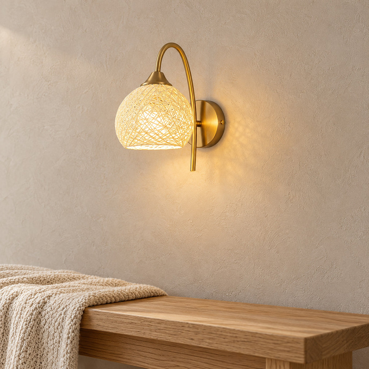 Remilvo gold battery operated wall sconce detail of the iron arm and round fitted backplate