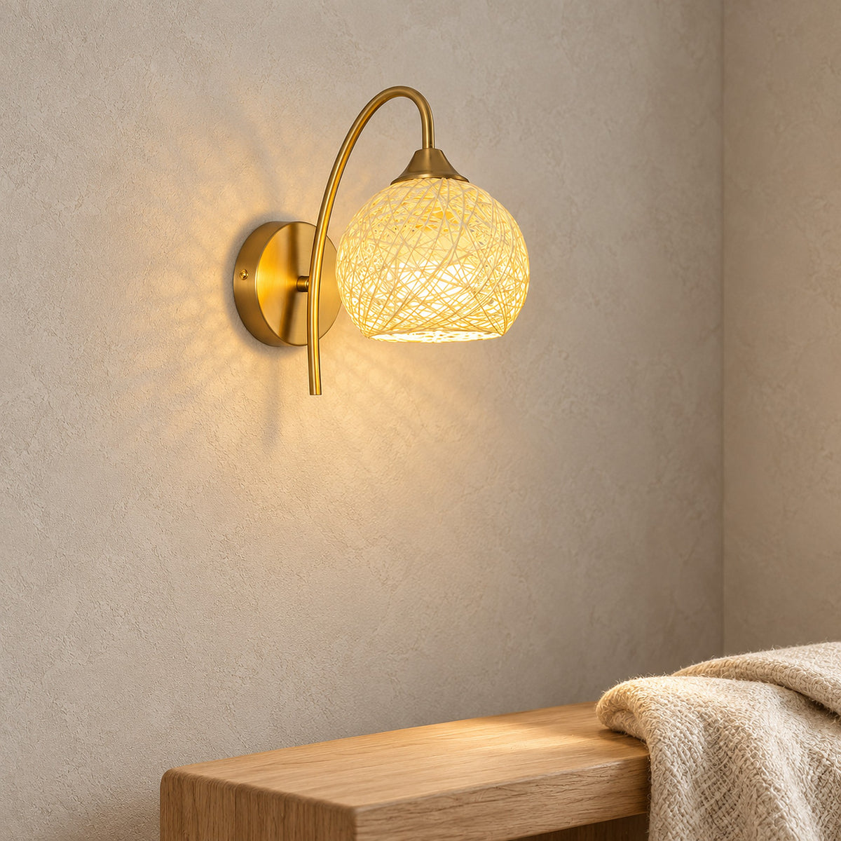 Remilvo gold cordless wall lamp glowing above a bench on a sunlit stair landing