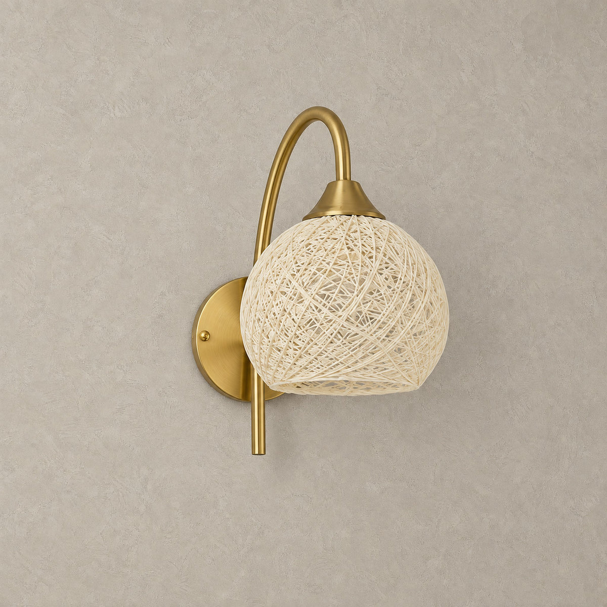 Remilvo gold rechargeable wall sconce with fabric shade, unlit against a greige plaster wall