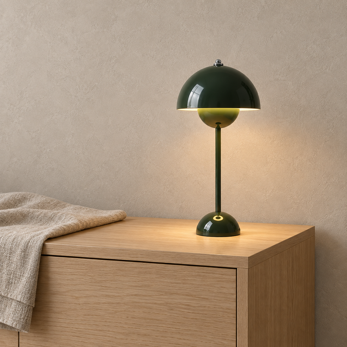 Retomira green rechargeable table lamp glowing on a dining sideboard in daylight #color_green