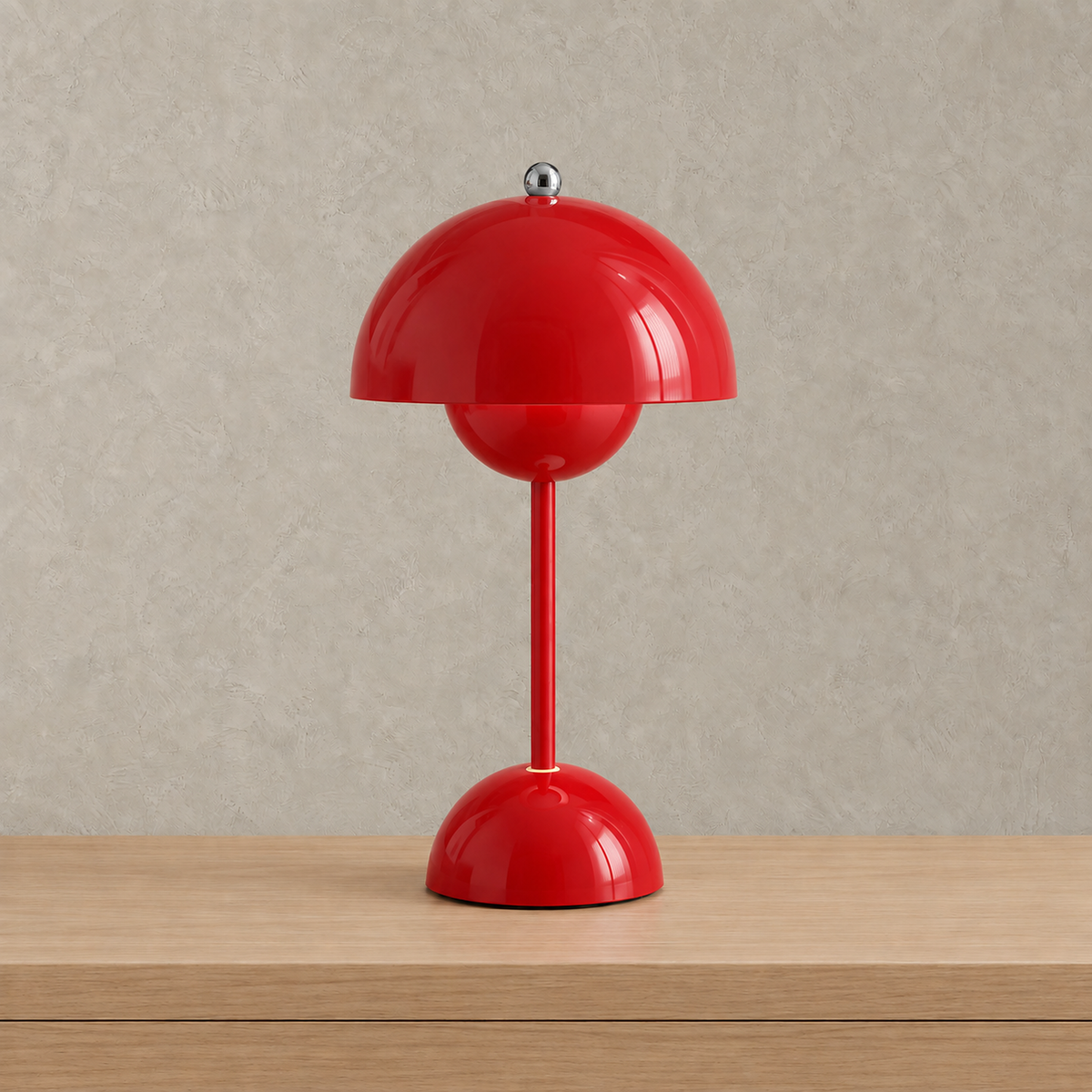 Retomira red battery operated table lamp unlit on its round base #color_red