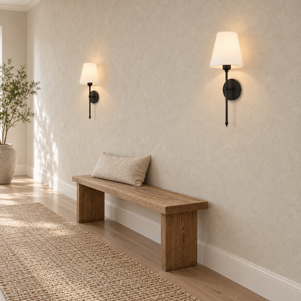 Rimavio black battery operated wall sconce pair lit on an uninterrupted hallway wall