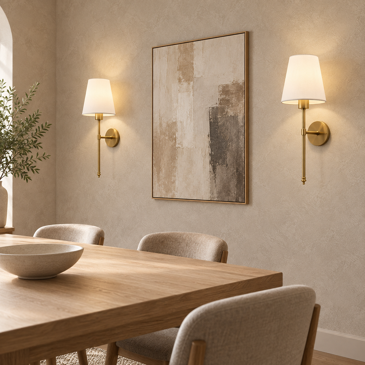 Rimavio gold cordless wall lamp pair lit beside dining room artwork in daylight #color_gold