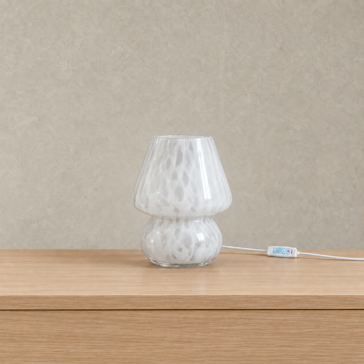 Rimelota white mushroom table lamp shown unlit with a speckled glass shade on a plain backdrop #color_white