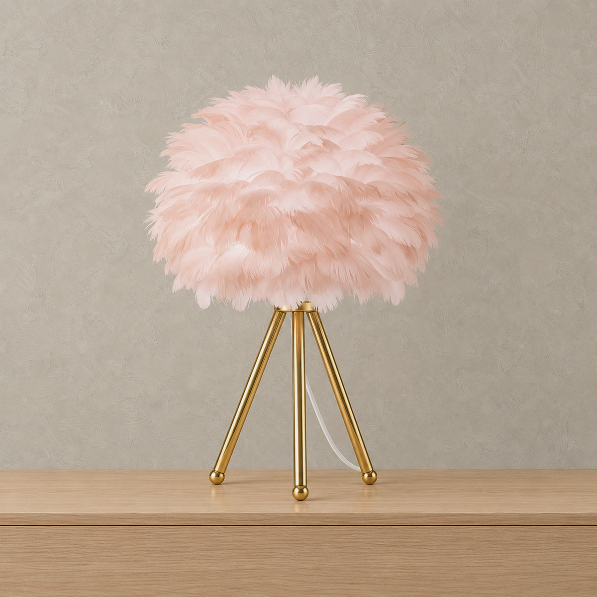 Rimolen light pink gold feather table lamp with layered feather shade and tripod base, shown unlit