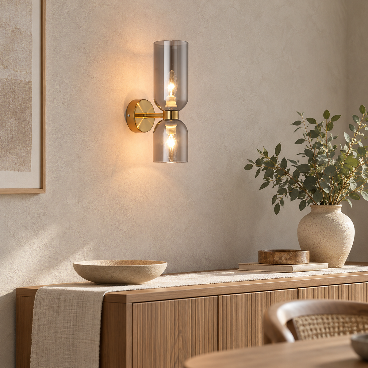 Riselona gold and smoke gray glass wall lamp lit above a dining room sideboard #color_gold & smoke gray glass