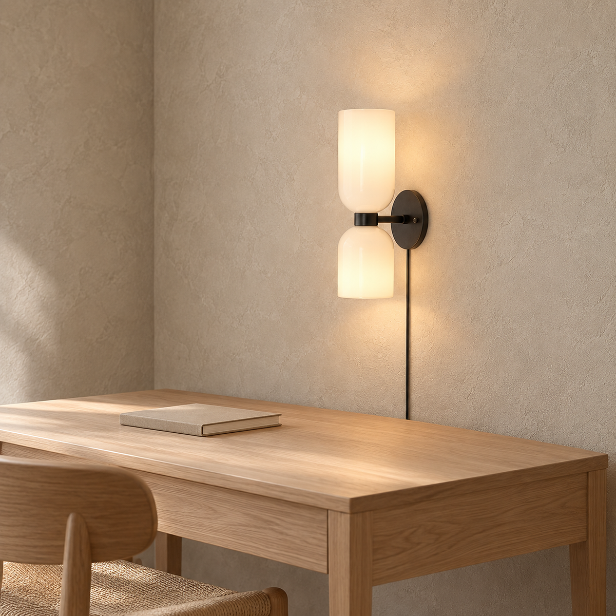 Riselona matte black and opal glass wall lamp lit above a clear writing desk #color_matte black & opal glass
