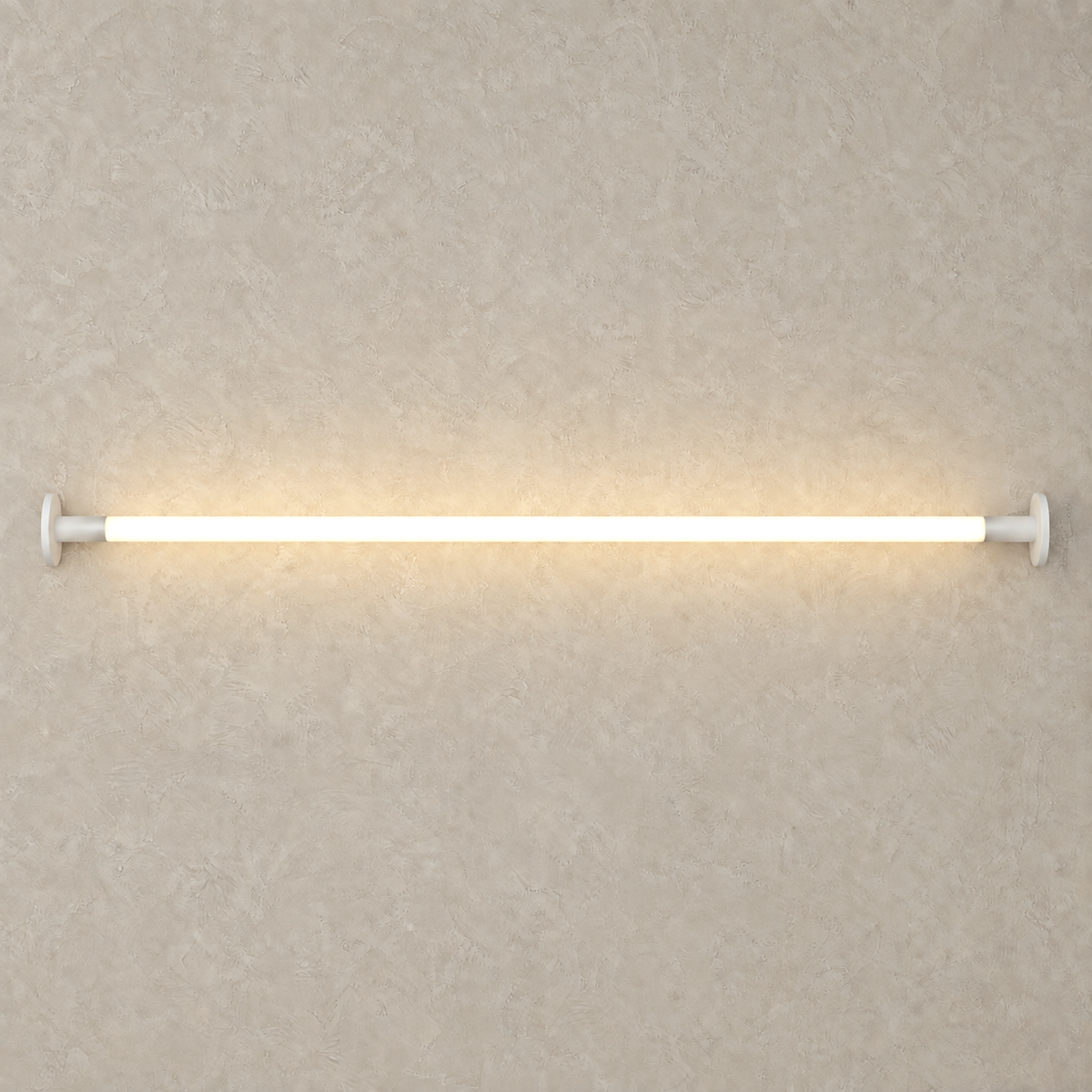 Ronelia white linear LED wall light glowing against warm greige plaster