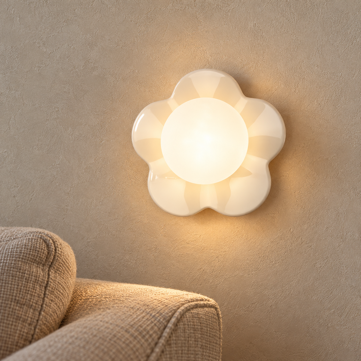 Rovilan white flower wall lamp casting warm light above an oatmeal sofa in a daylit living room