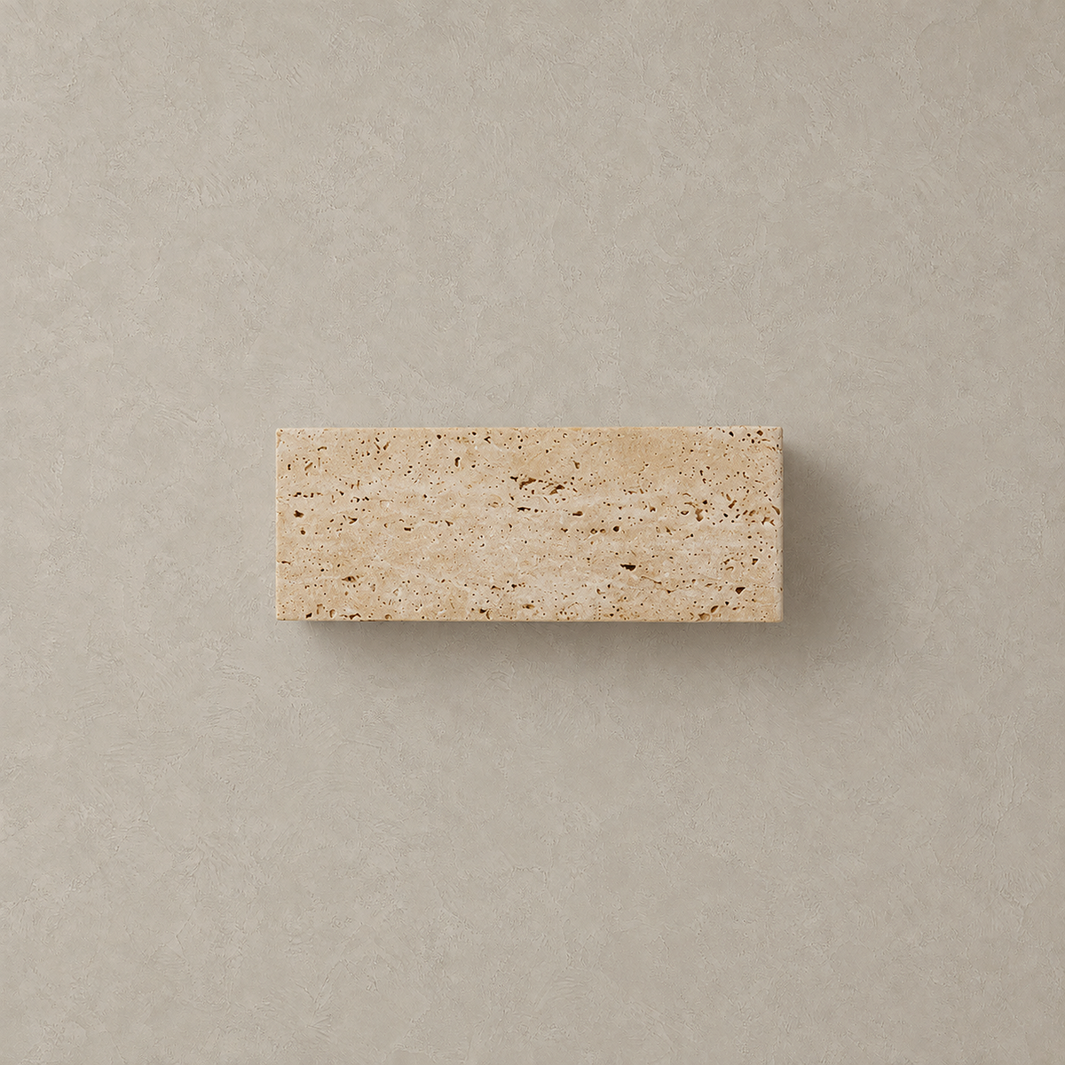 Sarivol beige stone hardwired wall sconce, unlit natural stone fixture shown on a plain plaster wall